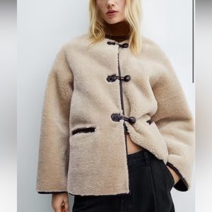 Mango fur-effect coat with appliqués
